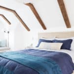 attic-bedroom-ideas-wooden-ceiling-beams-white-walls